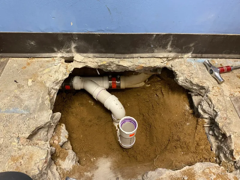Slab leak repair beneath a concrete foundation