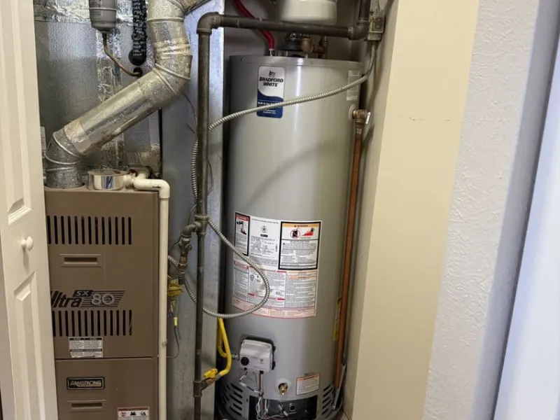 A&A Plumbing technician installing a water heater in an Encinitas home